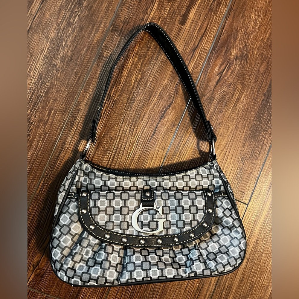 Purse with metallic “G”. Vintage Guess?  I honestly don’t know.